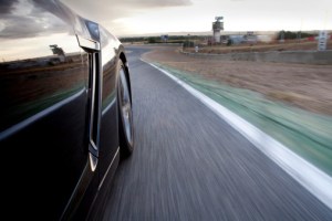 Car running in a racetrack.